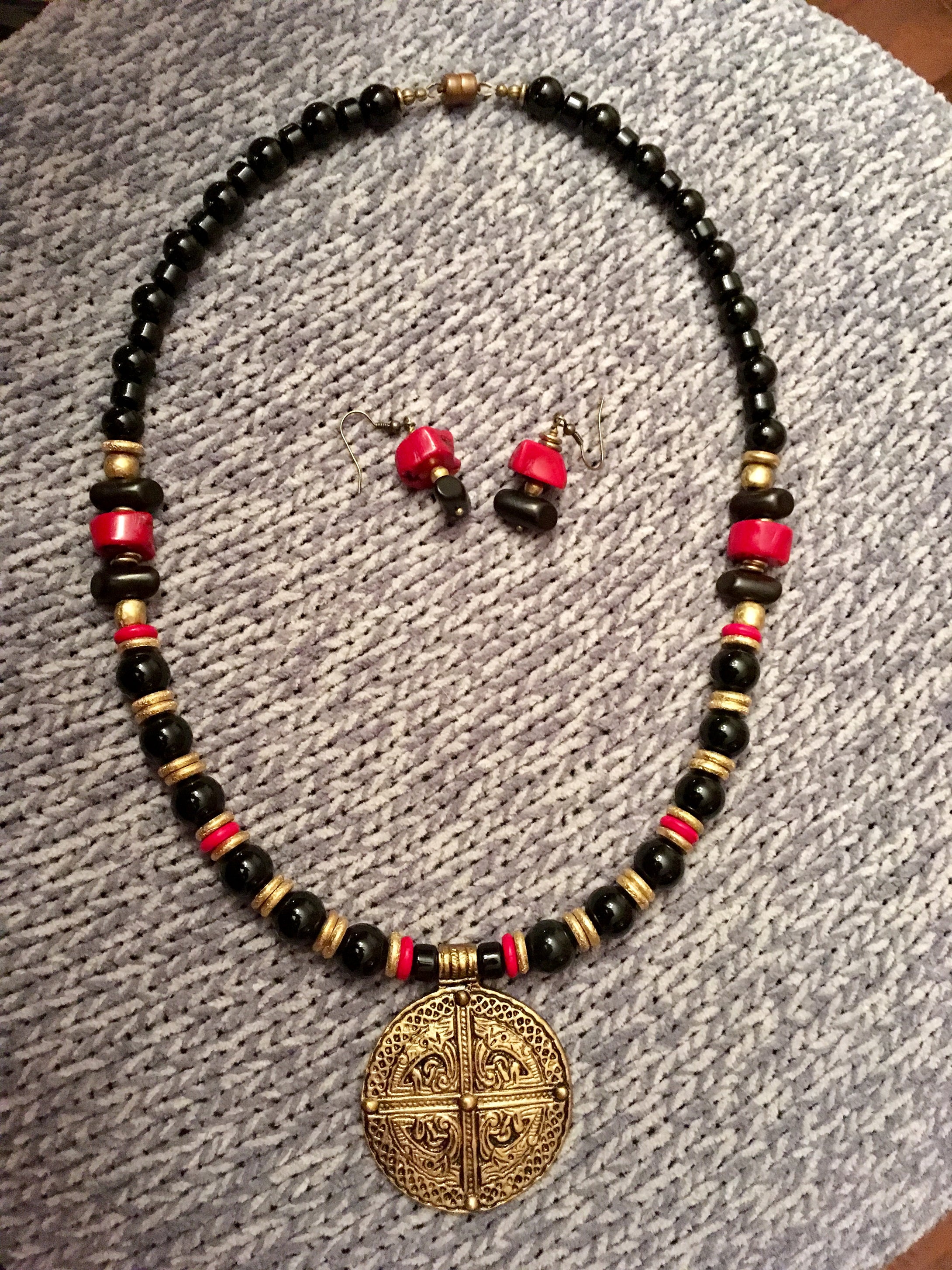 Black Onyx, Red Coral, African Brass.  24