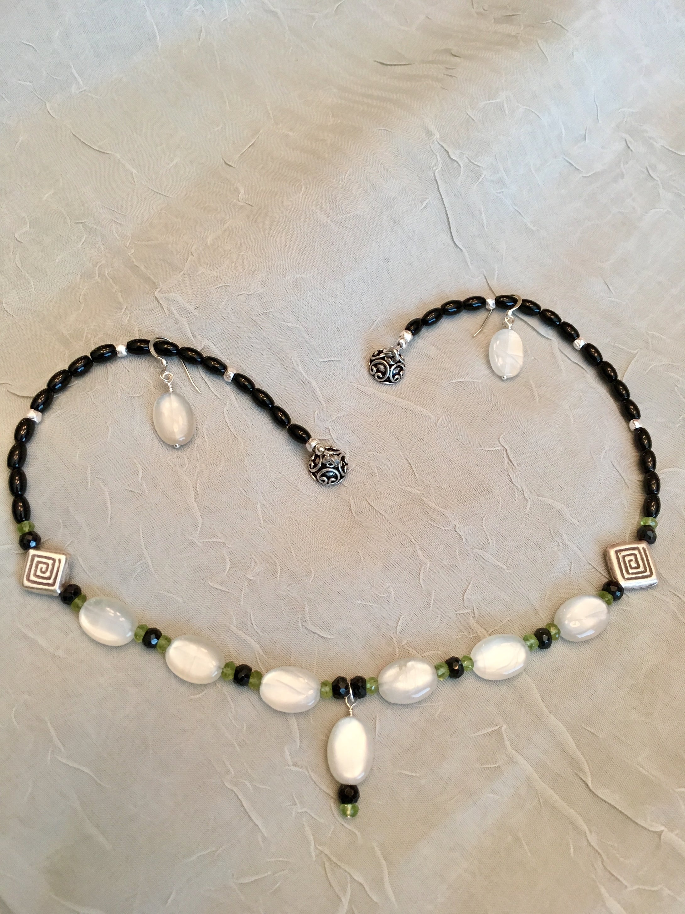 White Moonstone, Hill Tribe Silver, Peridot, Black Onyx, Spinel, Sterling Silver.  17